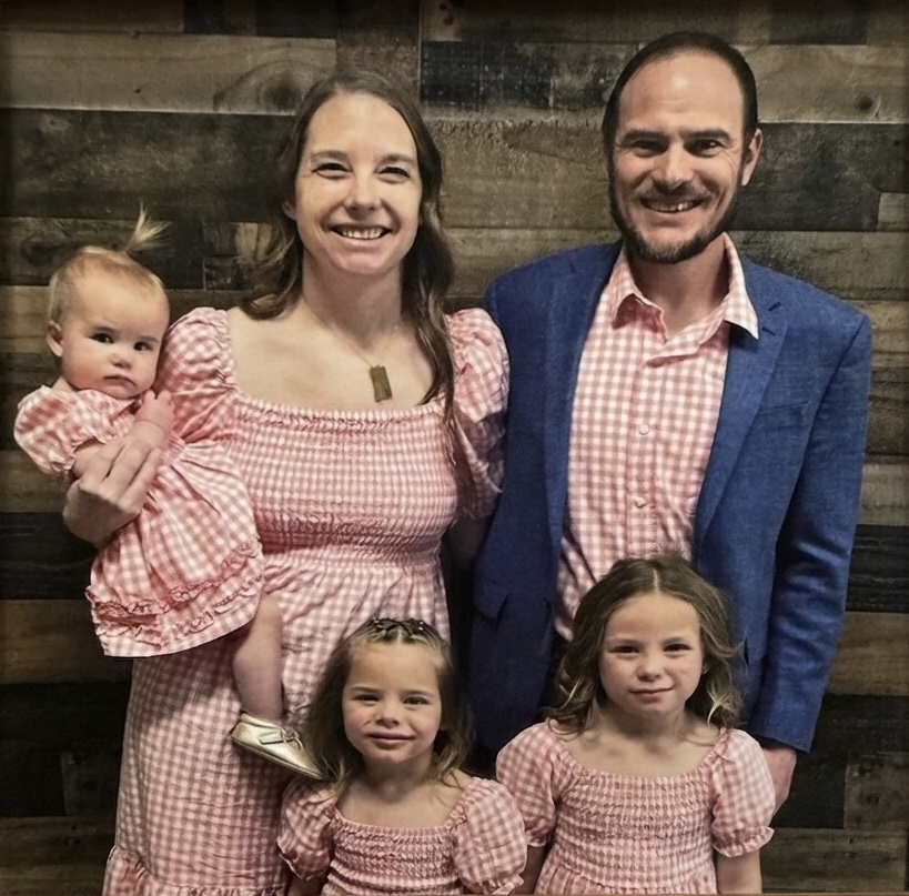 John Marble with his wife Jessica and their daughters.